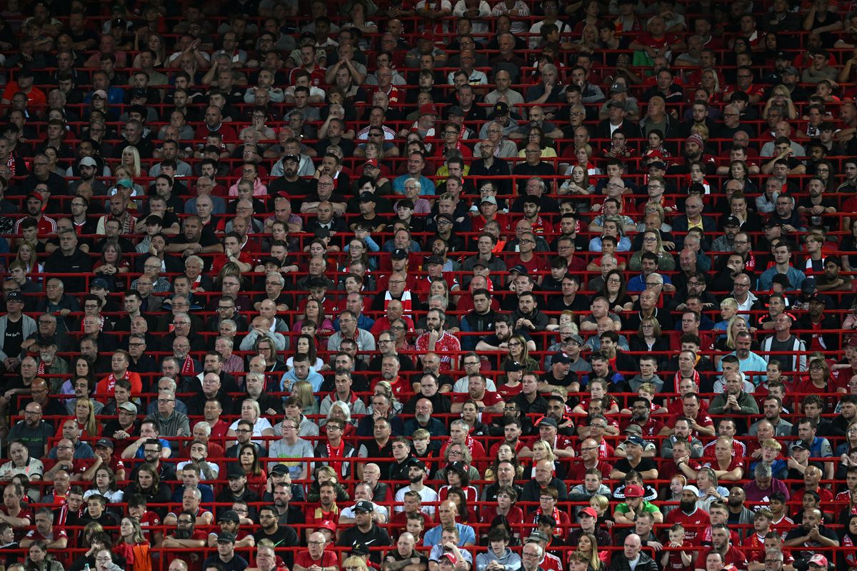 TOPSHOT - Liverpool fans in the rail seating watch the English Premier League football match between Liverpool and Newcastle United at Anfield in Liverpool, north west England on August 31, 2022.