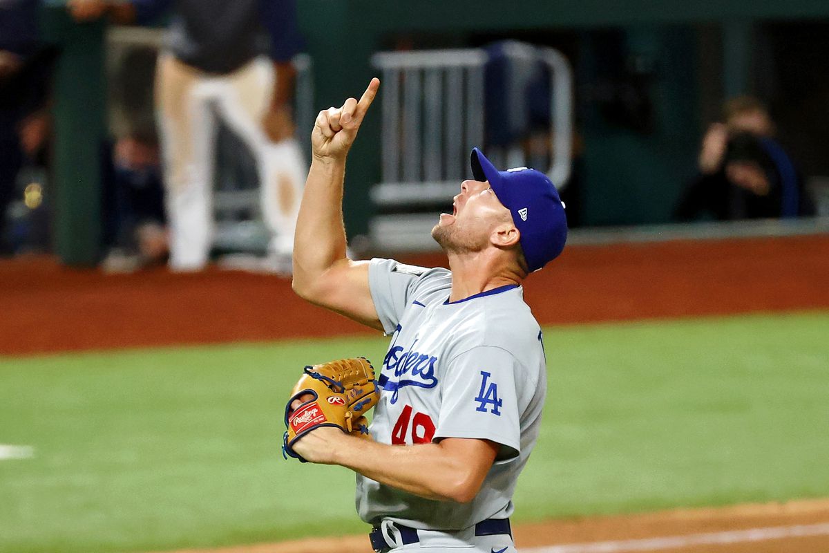 Dodgers relief pitcher Blake Treinen (49) reacts after striking out Tampa B...