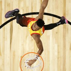 CORRECTS PHOTOGRAPHER AND SOURCE - Utah Jazz's Donovan Mitchell competes in the NBA basketball All-Star weekend slam dunk contest Saturday, Feb. 17, 2018, in Los Angeles. Mitchell won the event. (Bob Donnan/Pool via AP)
