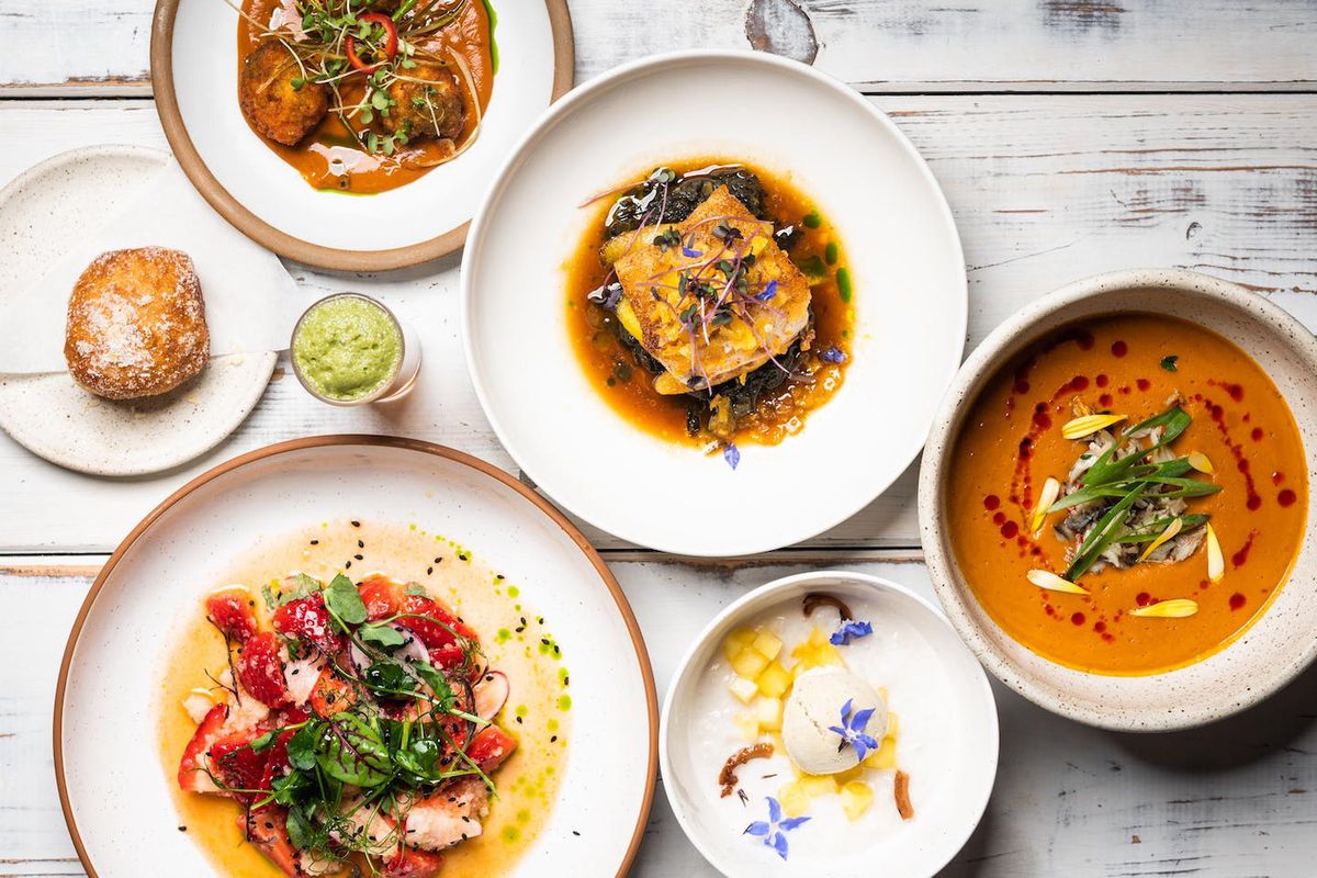 An overhead view of five colorful dishes from Dakar NOLA.