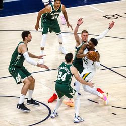 Utah Jazz guard Donovan Mitchell (45) goes to shoot the ball during a game against the Milwaukee Bucks at Vivint Smart Home Arena in Salt Lake City on Friday, Feb. 12, 2021.