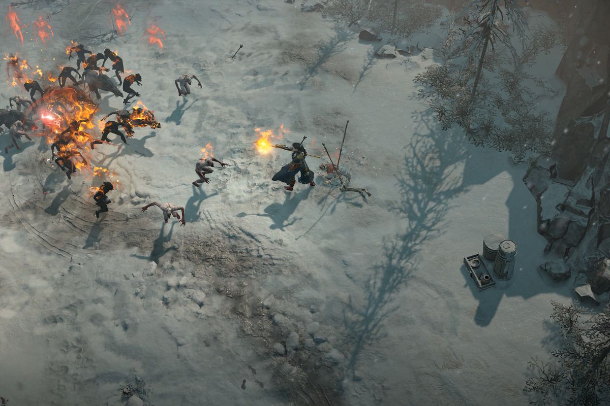 A sorcerer attacks a group of enemies in Diablo 4 while standing in a snow field
