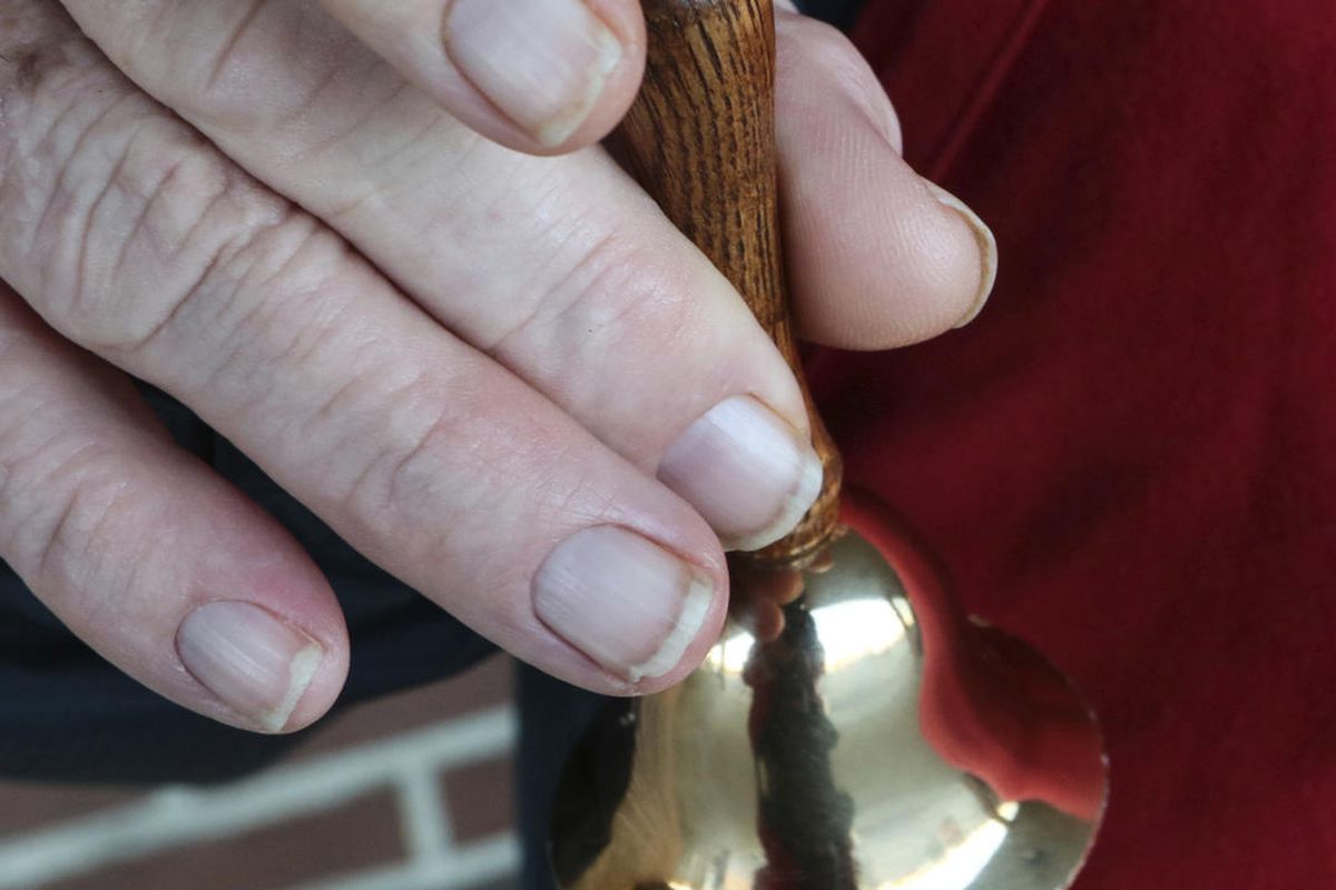 In this Dec. 9, 2016 photo, Salvation Army bell ringer James White rings his bell outside of Quality Foods in Anderson, S.C.