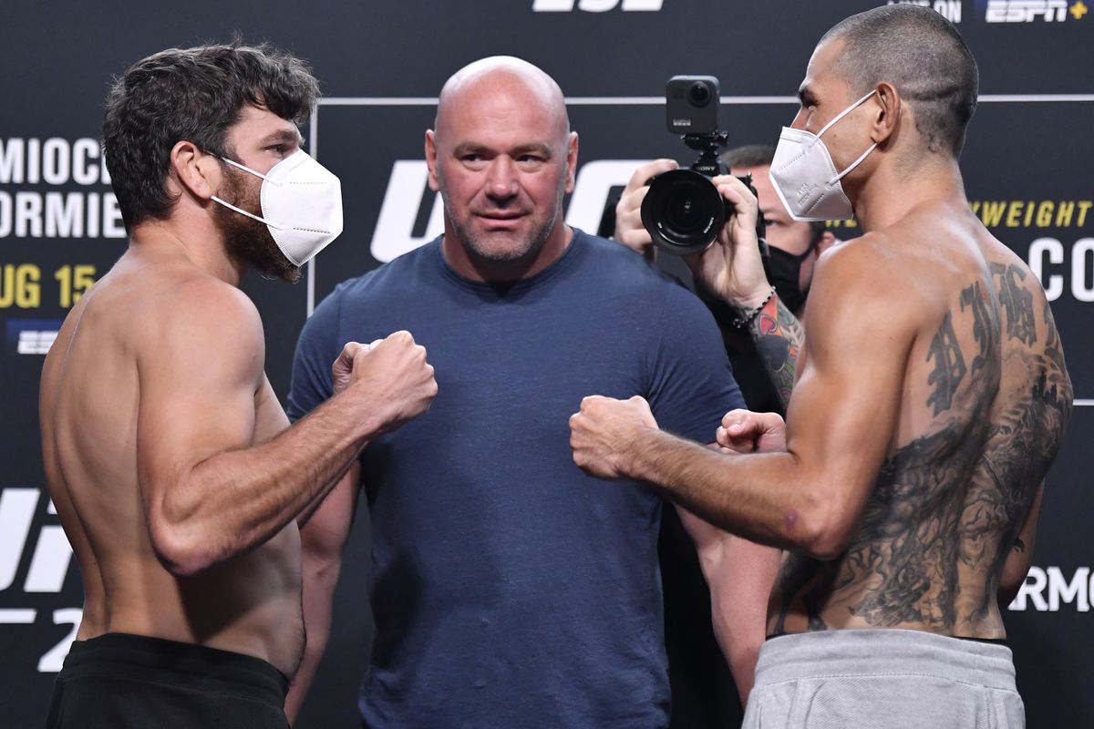 Opponents Jim Miller and Vinc Pichel face off during the UFC 252 weigh-in at UFC APEX on August 14, 2020 in Las Vegas, Nevada.