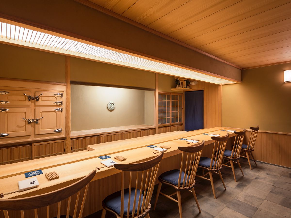A blonde wood-bedecked sushi bar with six seats