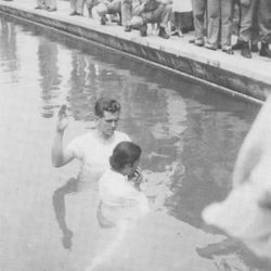 After World War II, Boyd K. Packer remained in Japan where, during his non-duty hours, he helped to share the gospel. Here he is preparing to perform a baptism.