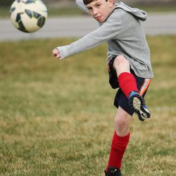 Isaac Nance, who has hemophilia — a rare bleeding disorder —  practices with his soccer team in Sandy on Thursday, March 24, 2016. 
