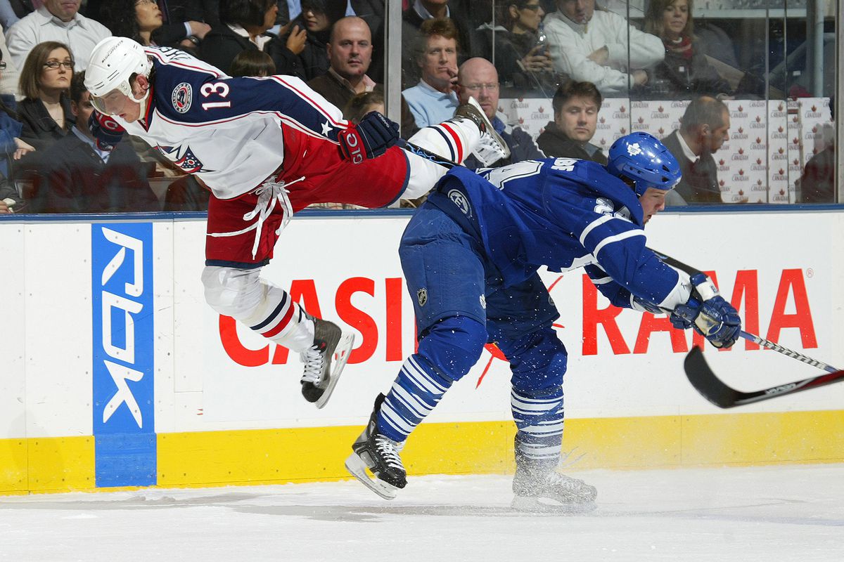 TORONTO,ON - FEBRUARY 19: Brian McCabe #24 of the Toronto Maple Leafs hammers Nikolai Zherdev #13 of the Columbus Blue Jackets in a game on February 19, 2008 at the Air Canada Centre in Toronto,Ontario. (Photo by Claus Andersen/Getty Images)