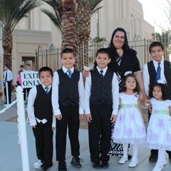 The Pickens family, of the Queen Creek Arizona North Stake, wait for husband and father to get the car after touring the Gilbert Arizona Temple. From left: James, Jacob, Daniel, Daniela (mom), Abigiel, Madelynn and Elijah.