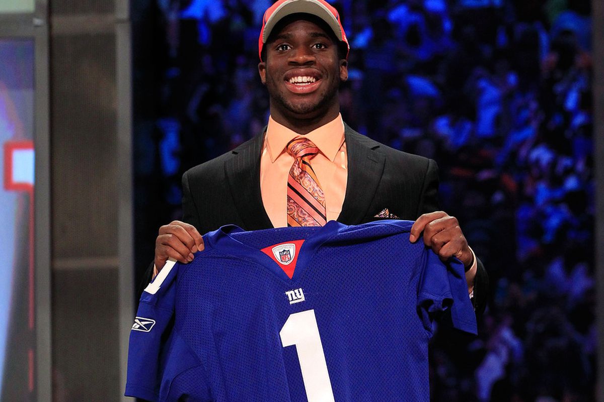 NEW YORK, NY - APRIL 28:  Prince Amukamara, #19 overall pick by the New York Giants, holds up a jersey on stage during the 2011 NFL Draft at Radio City Music Hall on April 28, 2011 in New York City.  (Photo by Chris Trotman/Getty Images)
