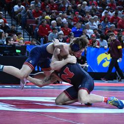 Nebraska’s Peyton Robb (right) wrestles Illinois’ Joe Roberts in the first round of the Big Ten Championships Saturday at the Pinnacle Bank Arena in Lincoln.