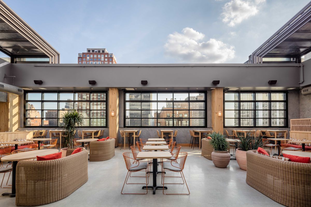 rooftop bar with tables and booths