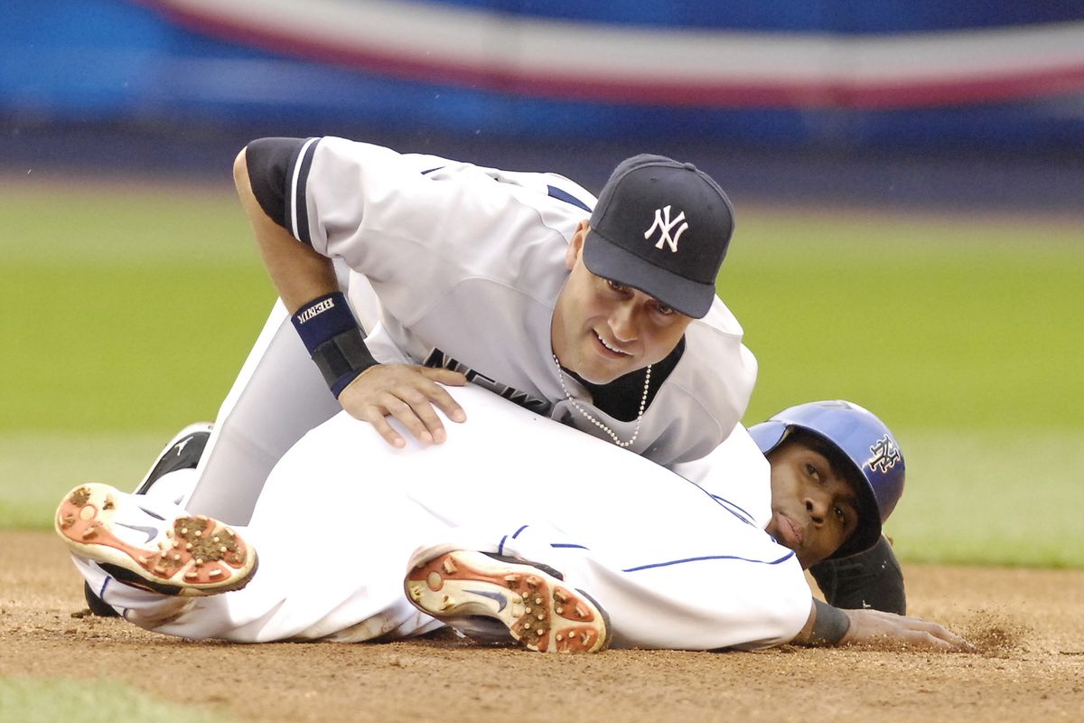 New York Mets’ Jose Reyes steals second base as New York Yan