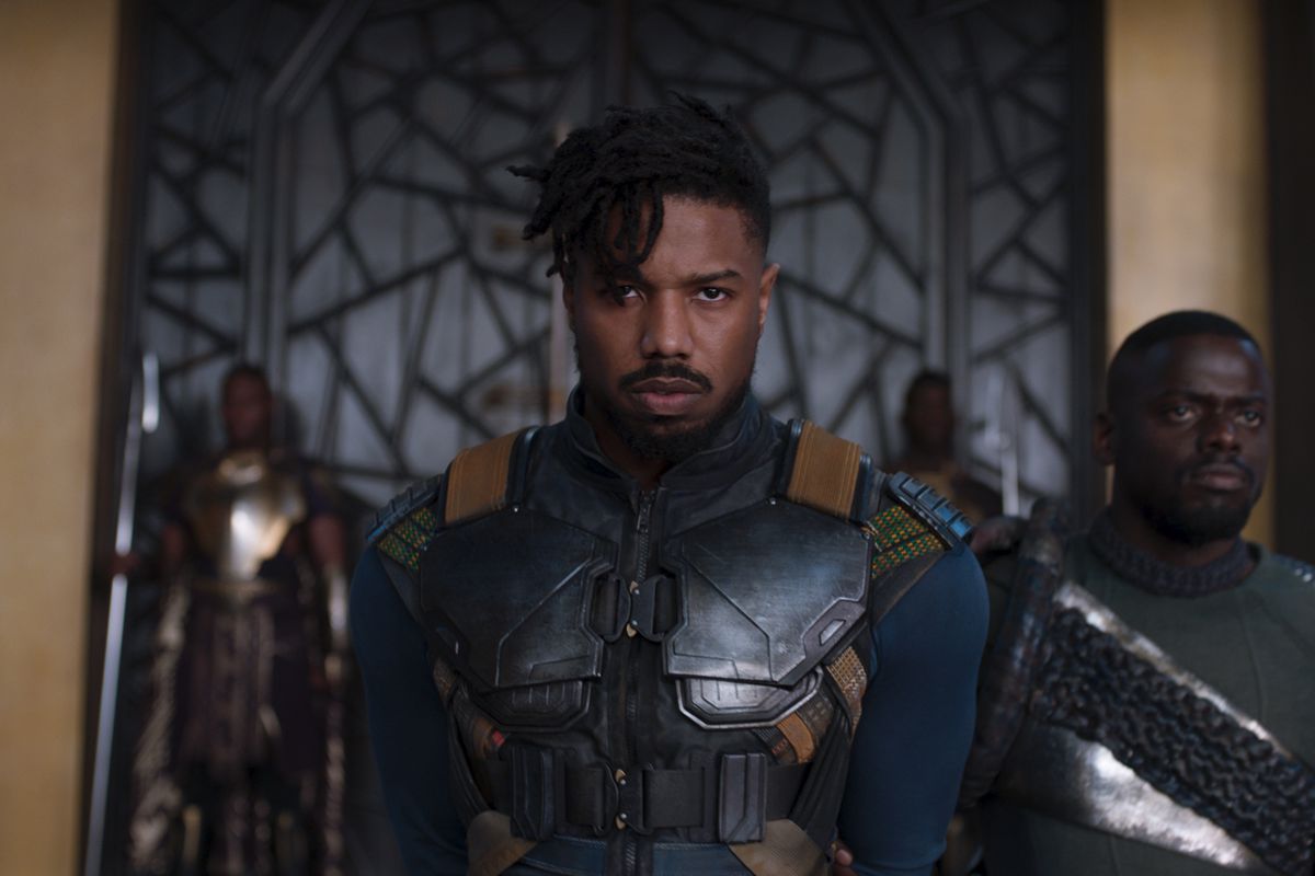 Erik Killmonger (Michael B. Jordan) enters the throne room of Wakanda, followed by W’Kabi (Daniel Kaluuya) in 2018’s Black Panther