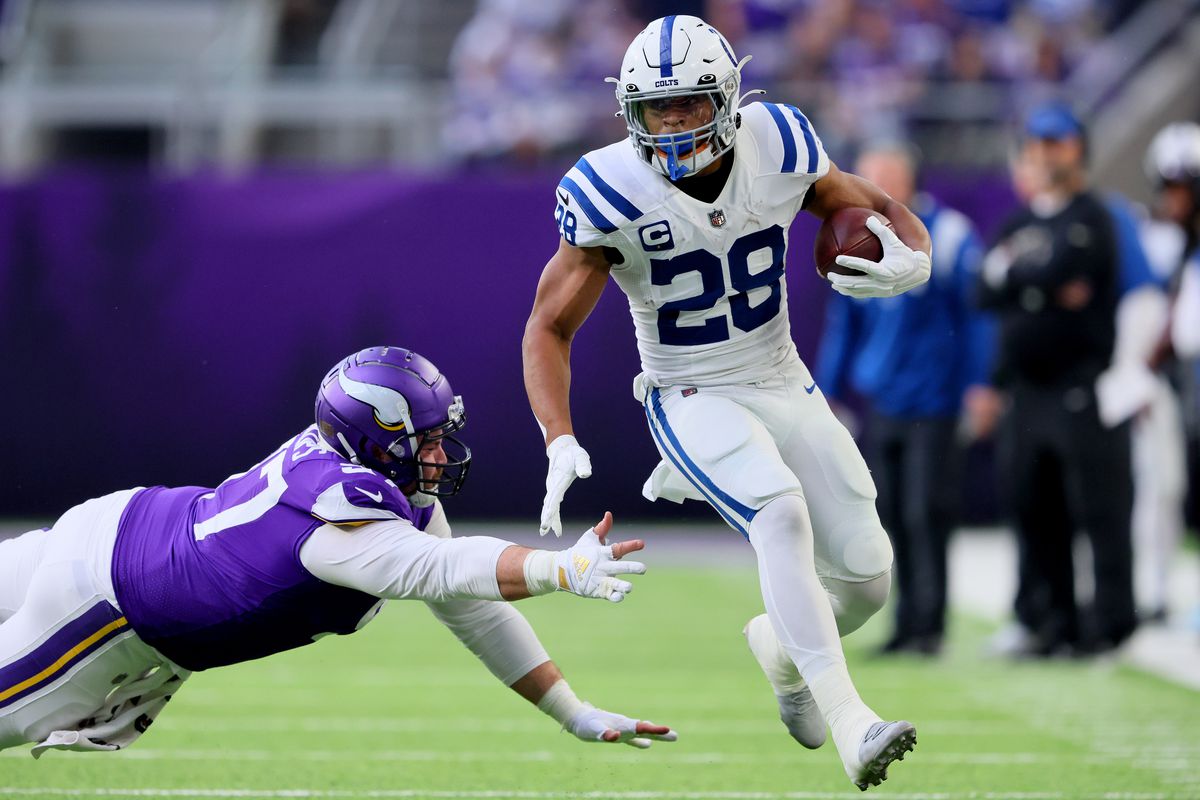 Jonathan Taylor #28 of the Indianapolis Colts carries the ball against the Minnesota Vikings during the first quarter at U.S. Bank Stadium on December 17, 2022 in Minneapolis, Minnesota.