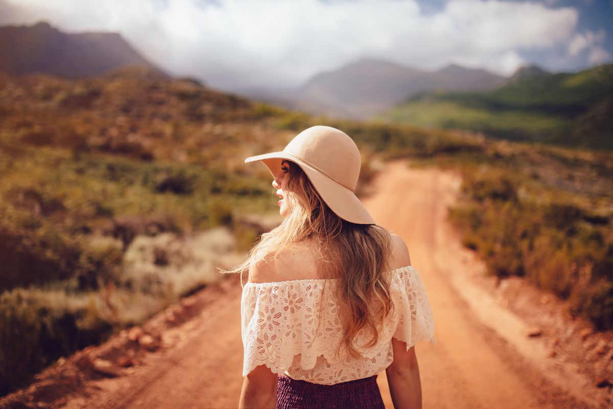 Girl wearing hat in a desert