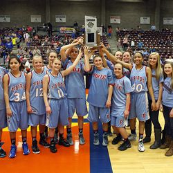 The Piute Thunderbirds receive a second-place trophy after they played the Panguitch Bobcats in the girls 1A basketball championship at the Sevier Valley Center in Richfield Saturday, Feb. 21, 2015. The Bobcats beat the Thunderbirds, 58-28.