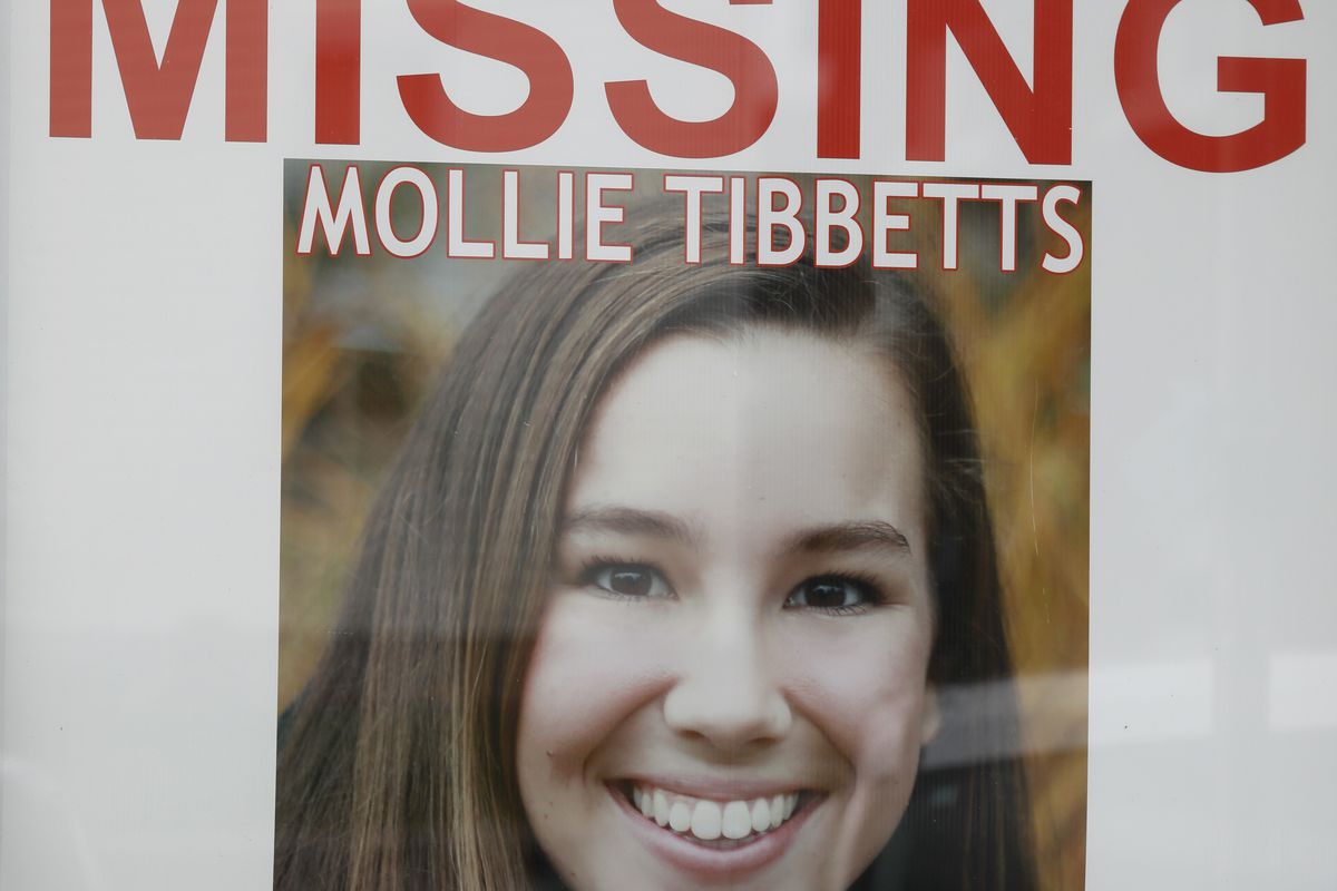 A “missing” poster for Mollie Tibbetts hangs in the window of a local business, on August 21, 2018, in Brooklyn, Iowa.