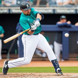 Cal Raleigh #29 of the Seattle Mariners hits the ball during a Spring Training exhibition game against Team Canada at Peoria Stadium on March 09, 2023 in Peoria, Arizona.