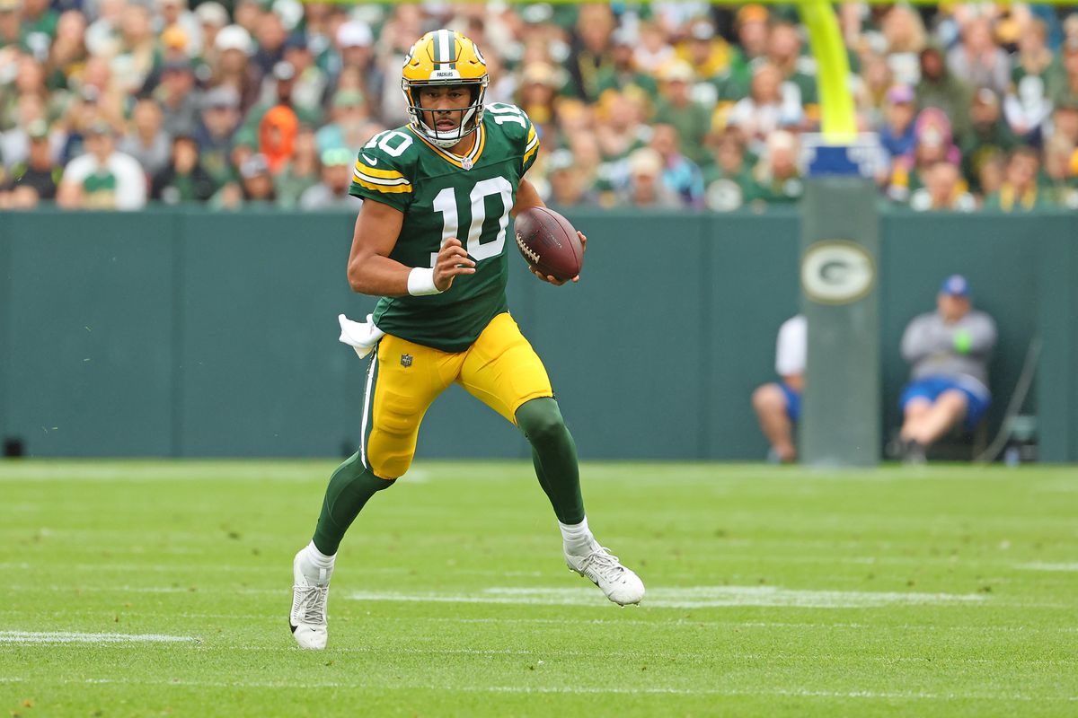 Jordan Love #10 of the Green Bay Packers runs for yards against the Seattle Seahawks during the first quarter of a preseason game at Lambeau Field on August 26, 2023 in Green Bay, Wisconsin.