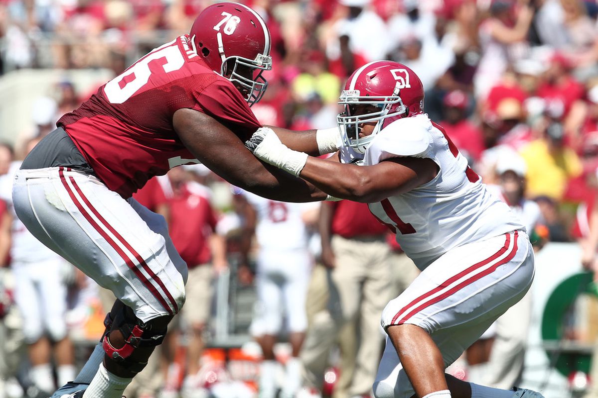 April 14, 2012; Tuscaloosa, AL, USA;  Alabama offensive lineman D.J. Fluker (76) is blocked by  defensive end D.J. Pettway (57) during the spring game at Bryant Denny Stadium. (Credit: Marvin Gentry-US PRESSWIRE)