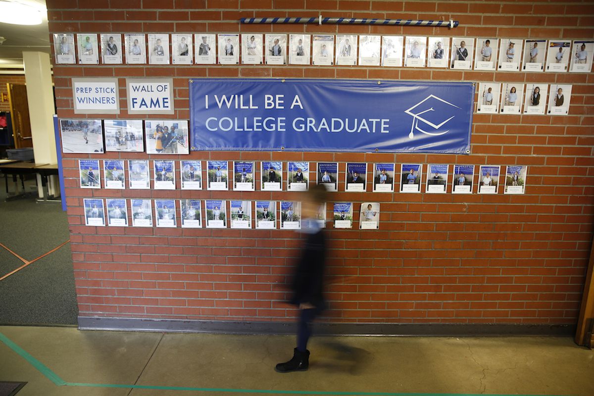 A student walks through the hallway of a Denver charter school.