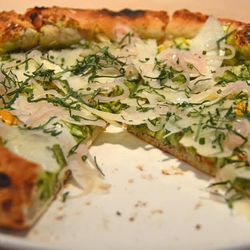 <strong>Herbs</strong>: Lastly, the pizza is liberally adorned with freshly chopped parsley and chives, pulling together the green background of the puree and closing the loop pizza pie perfection. 