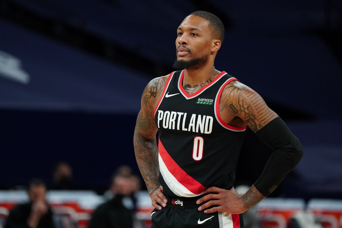 Damian Lillard of the Portland Trail Blazers looks on during the game against the Minnesota Timberwolves on March 14, 2021 at Target Center in Minneapolis, Minnesota.