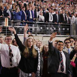 Attendees wave to President Russell M. Nelson of The Church of Jesus Christ of Latter-day Saints as he leaves a devotional at the State Farm Stadium in Phoenix on Sunday, Feb. 10, 2019.
