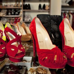 From left: Prada suede criss cross platforms, $850; Christian Louboutin Aborina suede peep-toe heels, $995.