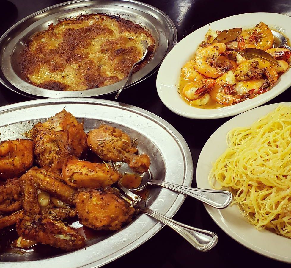 Plates of oysters Mosca, shrimp Mosca, spaghetti Bordelaise, and chicken a la grand
