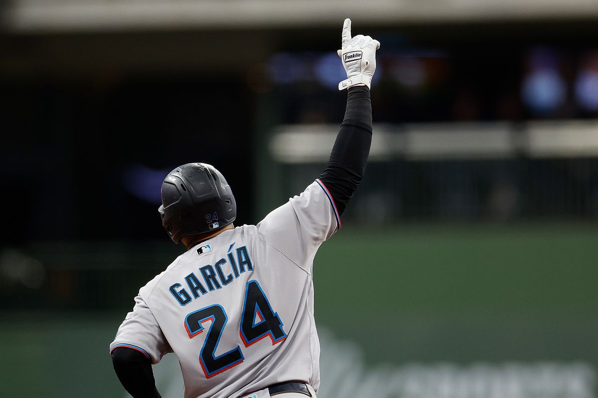 Avisail Garcia #24 of the Miami Marlins hits a three run homer in the eighth inning against the Milwaukee Brewers at American Family Field on September 29, 2022 in Milwaukee, Wisconsin.