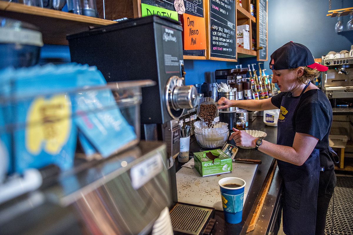 A barista sporting a backwards cap makes coffee at JavaVino during the Luke's pop-up.