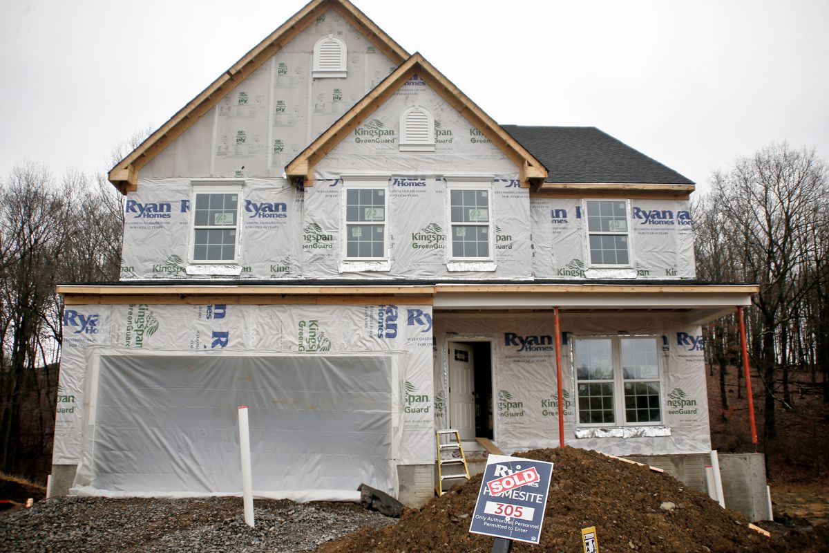 In this Friday, Feb. 16, 2018, photo, construction is under way at a new housing plan in Zelienople, Pa. On Monday, Feb. 26, 2018, the Commerce Department reports on sales of new homes in January. (AP Photo/Keith Srakocic)