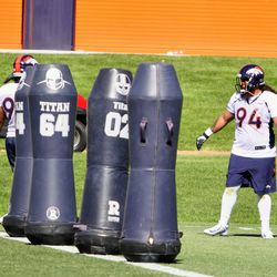 Nose tackle Domata Peko and the defensive line doing drills during the first day of Denver Broncos training camp. 