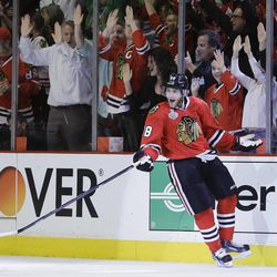 Chicago Blackhawks right wing Patrick Kane (88) reacts after scoring against the Boston Bruins in the first period during Game 5 of the NHL hockey Stanley Cup Finals, Saturday, June 22, 2013, in Chicago. (AP Photo/Nam Y. Huh)
