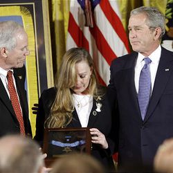 President Bush presents the Medal of Honor to Daniel and Maureen Murphy in honor of their son, Lt. Michael Murphy.