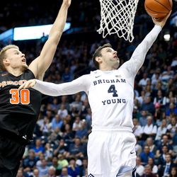 BYU guard Nick Emery (4) goes up for a layup while being guarded by Princeton forward Hans Brase (30) during an NCAA college basketball game Monday, Nov. 14, 2016, in Provo, Utah. (Sammy Jo Hester/The Daily Herald via AP)
