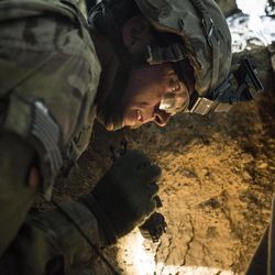 Murray soldier Thomas Wirthlin works with soldiers from the 3rd Tolai, 6th Kandak and 1st Battalion, 36th Infantry Regiment to rescue a 3-year-old boy who had fallen 30 feet down a well in Maiwand province April 7, 2013. 