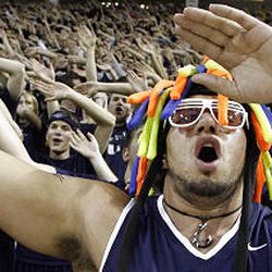 Funaki Asisi cheers with other Utah State fans before Utah State plays Nevada in a basketball game at the Dee Glen Smith Spectrum in Logan Saturday. The Aggies defeated the Wolfpack 76-65.
