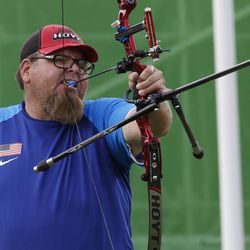 United States' Eric Bennett uses his mouth to pull back his arrow, as he competes in the individual recurve open archery event at the Paralympic Games at the Sambadrome in Rio de Janeiro, Brazil, Tuesday, Sept. 13, 2016.