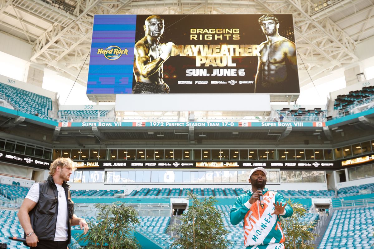 Floyd Mayweather and Logan Paul take part in media availability for their June 6 fight at Hard Rock Stadium on May 06, 2021 in Miami Gardens, Florida.