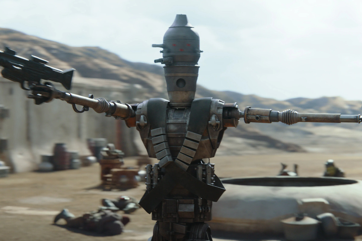 IG-11 (Taika Waititi) cleans house in chapter 1 of The Mandalorian. From Disney Plus’ The Mandalorian.