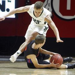 Timpview's Jordan Sagers, below, grabs a loose ball away from Olympus' Miles Keller (23) at the 4A boys' basketball championship game at the Huntsman Center in Salt Lake City, Saturday, March 5, 2016.
