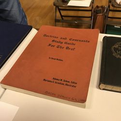 A table displays records and scriptures used by the Ogden LDS Deaf Branch during its 100-year history.