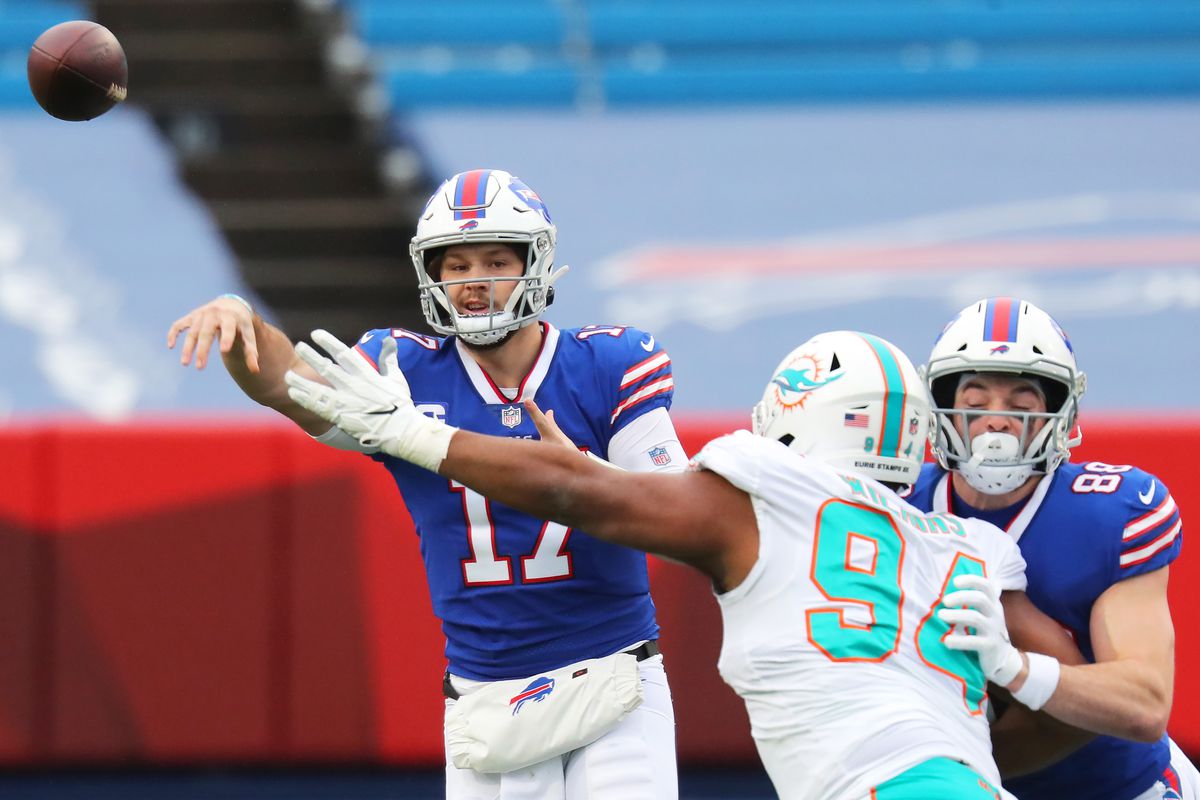 Josh Allen #17 of the Buffalo Bills makes a pass against the Miami Dolphins in the first half at Bills Stadium on January 03, 2021 in Orchard Park, New York.
