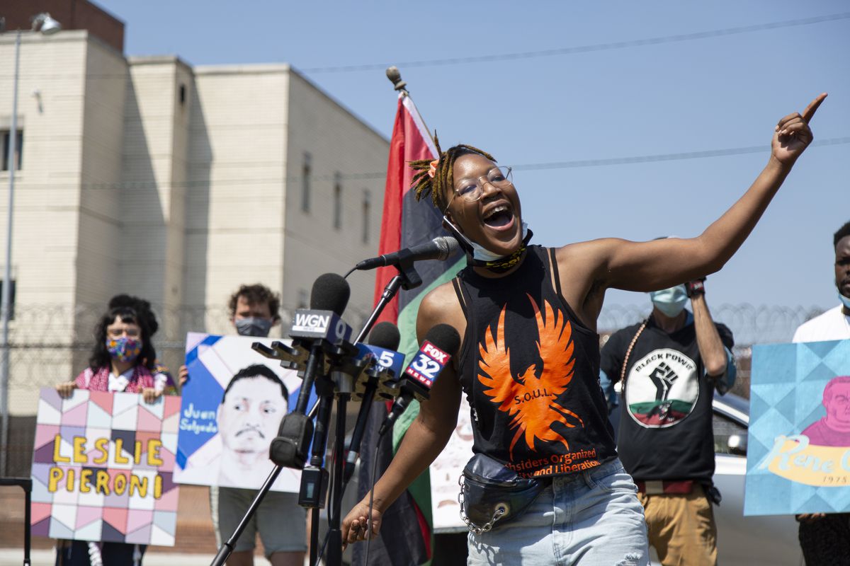 Ariel Atkins, of Black Lives Matters Chicago, calls for defunding the Chicago Police Department during a protest Thursday outside Cook County Jail