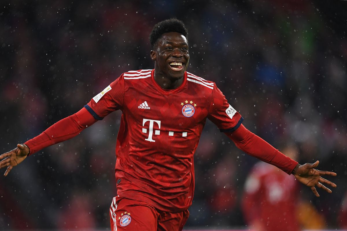 MUNICH, GERMANY - MARCH 17: Alphonso Davies of Bayern Munich celebrates scoring his teams sixth goal of the game during the Bundesliga match between FC Bayern Muenchen and 1. FSV Mainz 05 at Allianz Arena on March 17, 2019 in Munich, Germany.