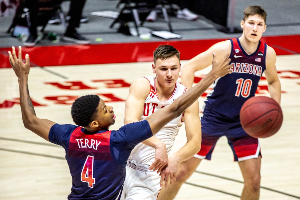 The Utah Utes and Arizona Wildcats fight for the ball during a men’s basketball game at the Huntsman Center in Salt Lake City on Thursday, Feb. 4, 2021.