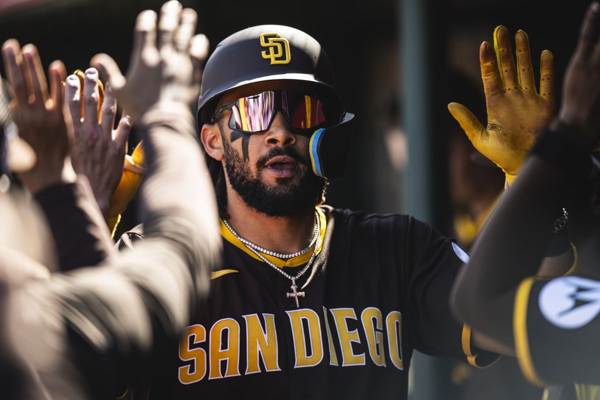 Fernando Tatis Jr. of the San Diego Padres celebrates in the dugout after hitting a home run during a spring training game against the Los Angeles Angels on March 24, 2023 at the Tempe Diablo Stadium in Tempe, Arizona.